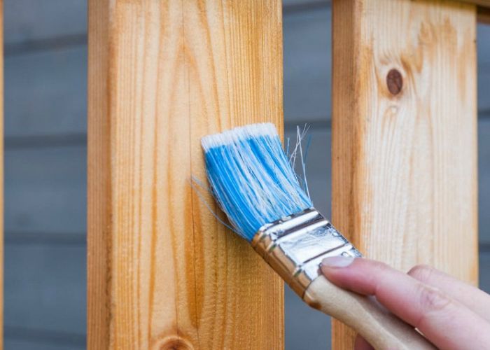 What are the benefits of buying pre-stained wood fencing?