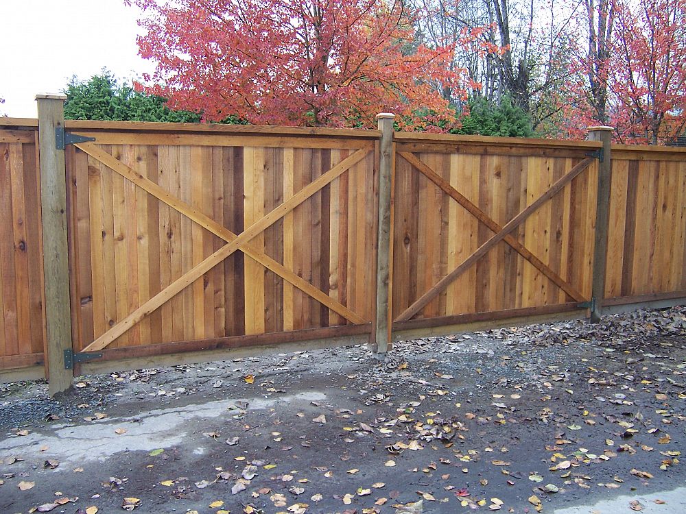 What maintenance does my wood fence require in the fall?