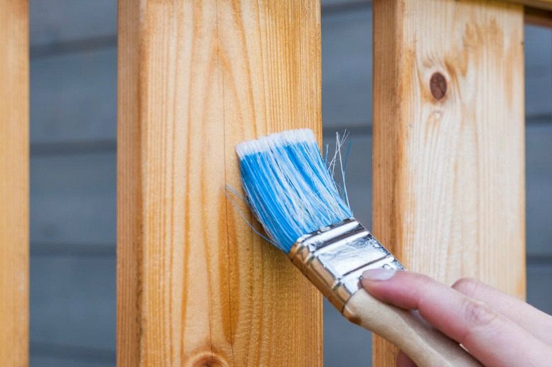What are the benefits of buying pre-stained wood fencing?