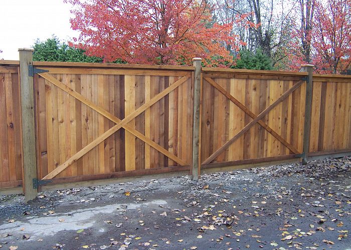 What maintenance does my wood fence require in the fall?